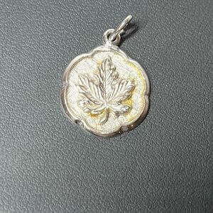 Vintage sterling silver maple leaf Canada pendant charm.